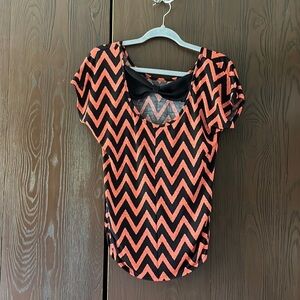 NA orange/ black top. Black bow in the back. Size Medium
